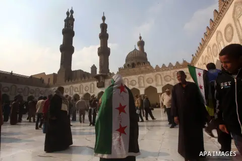 Egyptian protestors gather during a rally in support of the Syrian people and against Syria's President Bashar al-Assad at Al-Azhar mosque in Cairo, on December 28, 2012. Syrian warplanes launched air raids in Damascus p...