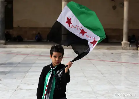 Egyptian protestors gather during a rally in support of the Syrian people and against Syria's President Bashar al-Assad at Al-Azhar mosque in Cairo, on December 28, 2012. Syrian warplanes launched air raids in Damascus p...