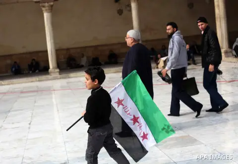Egyptian protestors gather during a rally in support of the Syrian people and against Syria's President Bashar al-Assad at Al-Azhar mosque in Cairo, on December 28, 2012. Syrian warplanes launched air raids in Damascus p...