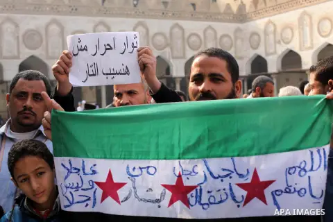 Egyptian protestors gather during a rally in support of the Syrian people and against Syria's President Bashar al-Assad at Al-Azhar mosque in Cairo, on December 28, 2012. Syrian warplanes launched air raids in Damascus p...