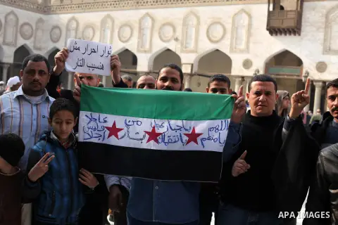 Egyptian protestors gather during a rally in support of the Syrian people and against Syria's President Bashar al-Assad at Al-Azhar mosque in Cairo, on December 28, 2012. Syrian warplanes launched air raids in Damascus p...