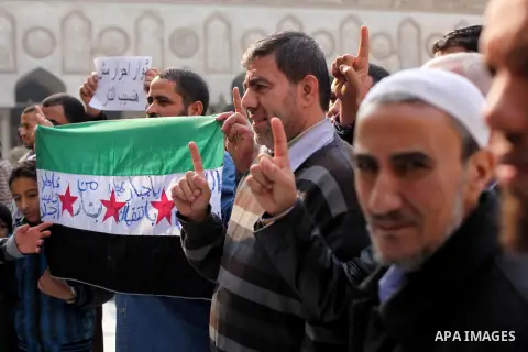 Egyptian protestors gather during a rally in support of the Syrian people and against Syria's President Bashar al-Assad at Al-Azhar mosque in Cairo, on December 28, 2012. Syrian warplanes launched air raids in Damascus p...