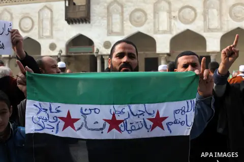 Egyptian protestors gather during a rally in support of the Syrian people and against Syria's President Bashar al-Assad at Al-Azhar mosque in Cairo, on December 28, 2012. Syrian warplanes launched air raids in Damascus p...