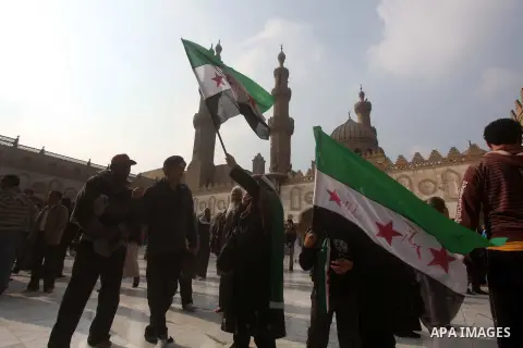 Egyptian protestors gather during a rally in support of the Syrian people and against Syria's President Bashar al-Assad at Al-Azhar mosque in Cairo, on December 28, 2012. Syrian warplanes launched air raids in Damascus p...