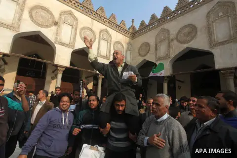 Egyptian protestors gather during a rally in support of the Syrian people and against Syria's President Bashar al-Assad at Al-Azhar mosque in Cairo, on December 28, 2012. Syrian warplanes launched air raids in Damascus p...