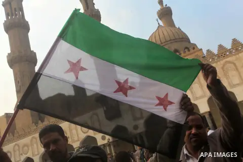 Egyptian protestors gather during a rally in support of the Syrian people and against Syria's President Bashar al-Assad at Al-Azhar mosque in Cairo, on December 28, 2012. Syrian warplanes launched air raids in Damascus p...