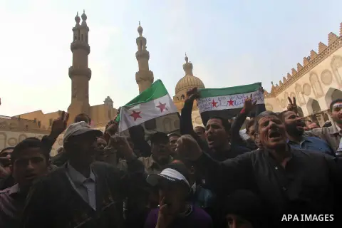Egyptian protestors gather during a rally in support of the Syrian people and against Syria's President Bashar al-Assad at Al-Azhar mosque in Cairo, on December 28, 2012. Syrian warplanes launched air raids in Damascus p...