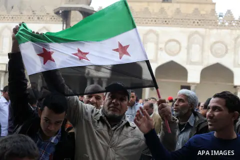 Egyptian protestors gather during a rally in support of the Syrian people and against Syria's President Bashar al-Assad at Al-Azhar mosque in Cairo, on December 28, 2012. Syrian warplanes launched air raids in Damascus p...