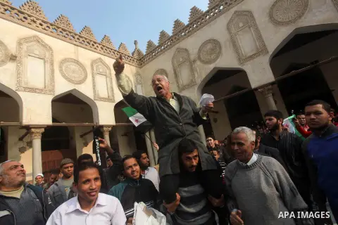 Egyptian protestors gather during a rally in support of the Syrian people and against Syria's President Bashar al-Assad at Al-Azhar mosque in Cairo, on December 28, 2012. Syrian warplanes launched air raids in Damascus p...