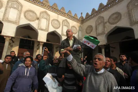 Egyptian protestors gather during a rally in support of the Syrian people and against Syria's President Bashar al-Assad at Al-Azhar mosque in Cairo, on December 28, 2012. Syrian warplanes launched air raids in Damascus p...