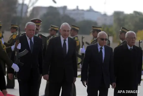 Arab League Secretary-General Nabil Elaraby, and Egyptian foreign Minister Mohamed Kamel Amr, walk past an honor guard during an arrival ceremony in the West Bank city of Ramallah, Dec. 29, 2012. Photo by Issam Rimawi