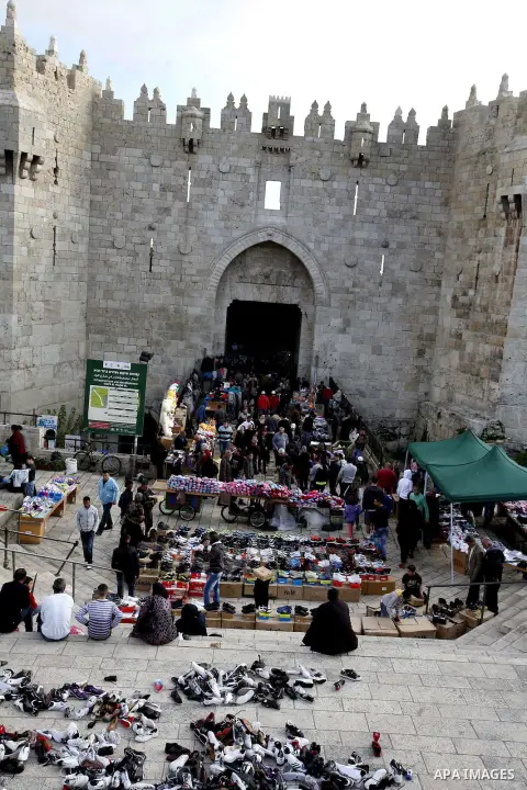 Palestinians shop at the market in Jerusalem's old city on December 29, 2012. Photo by Mahfouz Abu Turk