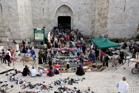 Palestinians shop at the market in Jerusalem's old city on December 29, 2012. Photo by Mahfouz Abu Turk