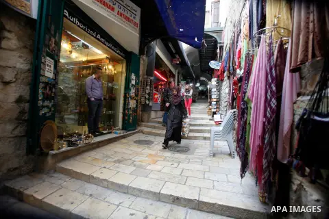 Palestinians shop at the market in Jerusalem's old city on December 29, 2012. Photo by Mahfouz Abu Turk