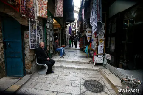 Palestinians shop at the market in Jerusalem's old city on December 29, 2012. Photo by Mahfouz Abu Turk