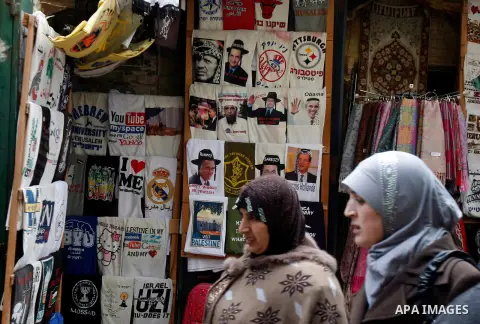 Palestinians shop at the market in Jerusalem's old city on December 29, 2012. Photo by Mahfouz Abu Turk