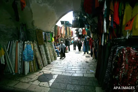 Palestinians shop at the market in Jerusalem's old city on December 29, 2012. Photo by Mahfouz Abu Turk