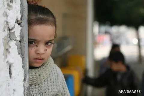 Palestinian children fill plastic bottles with drinking water in Rafah camp southern Gaza Strip, on Dec. 30, 2012. The residents of the Gaza strip suffer from lack of potable water, Israel continues to tighten its blocka...