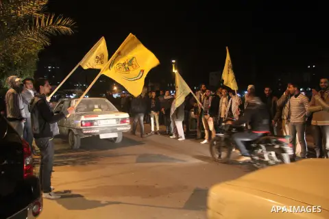 Palestinian supporters of Fatah movement hold the party's flags during a rally in Gaza city on December 30, 2012. The Gaza branch of Palestinian president Mahmud Abbas's Fatah party said on Friday it will mark its annive...
