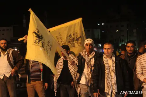 Palestinian supporters of Fatah movement hold the party's flags during a rally in Gaza city on December 30, 2012. The Gaza branch of Palestinian president Mahmud Abbas's Fatah party said on Friday it will mark its annive...