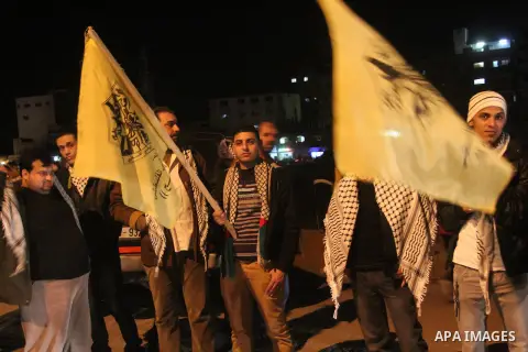 Palestinian supporters of Fatah movement hold the party's flags during a rally in Gaza city on December 30, 2012. The Gaza branch of Palestinian president Mahmud Abbas's Fatah party said on Friday it will mark its annive...