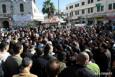 Palestinians shout slogans during a demonstration against the economic situation and against Palestinian prime minister Salam Fayyad in the northern West Bank city of Nablus on December 31, 2012. The protest came after F...