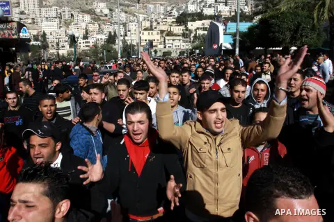 Palestinians shout slogans during a demonstration against the economic situation and against Palestinian prime minister Salam Fayyad in the northern West Bank city of Nablus on December 31, 2012. The protest came after F...
