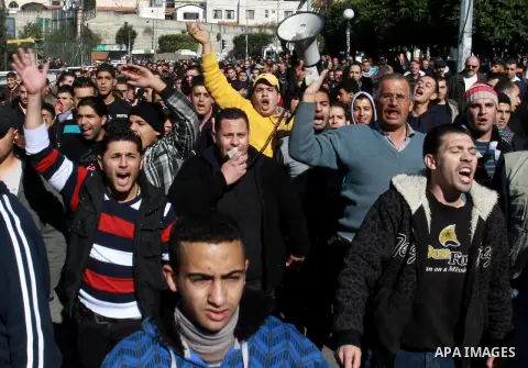 Palestinians shout slogans during a demonstration against the economic situation and against Palestinian prime minister Salam Fayyad in the northern West Bank city of Nablus on December 31, 2012. The protest came after F...