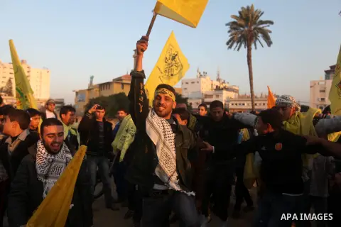 Palestinian supporters of Fatah movement hold the party's flags during a rally in Gaza city on December 31, 2012. The Gaza branch of Palestinian president Mahmud Abbas's Fatah party said on Friday it will mark its annive...