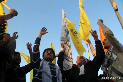 Palestinian supporters of Fatah movement hold the party's flags during a rally in Gaza city on December 31, 2012. The Gaza branch of Palestinian president Mahmud Abbas's Fatah party said on Friday it will mark its annive...
