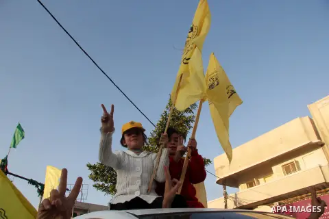 Palestinian children mark victory sign during a rally in Gaza city on December 31, 2012. The Gaza branch of Palestinian president Mahmud Abbas's Fatah party said on Friday it will mark its anniversary in the Hamas-ruled...
