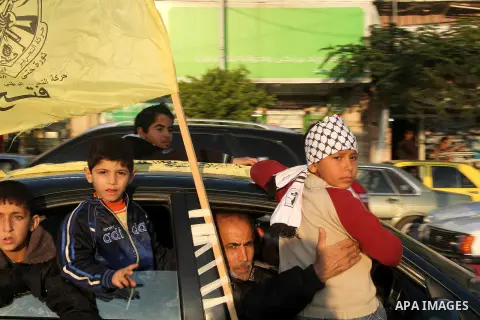 Palestinian supporters of Fatah movement hold the party's flags during a rally in Gaza city on December 31, 2012. The Gaza branch of Palestinian president Mahmud Abbas's Fatah party said on Friday it will mark its annive...