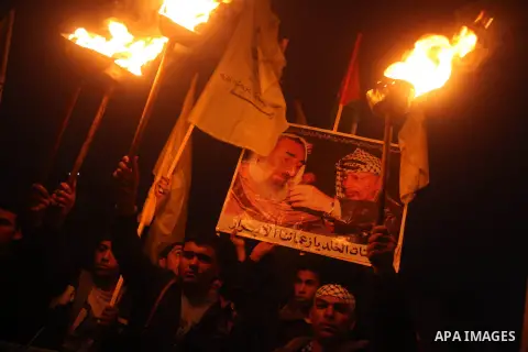 Palestinian supporters of Fatah movement hold the party's flags during a rally in Gaza city on December 31, 2012. The Gaza branch of Palestinian president Mahmud Abbas's Fatah party said on Friday it will mark its annive...