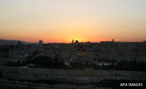 A general photo shows the Dome of the Rock mosque during the sunset on the last day of the year on December 31, 2012. Photo by Mahfouz Abu Turk