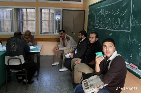 Palestinians update their details at a centre run by the Palestinian Central Election Commission (CEC), in Gaza city on February 12, 2013. The Palestinian Central Election Commission (CEC) began on Monday registering vot...