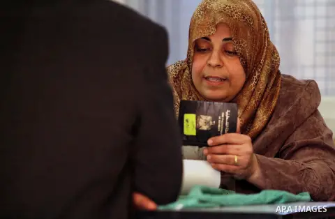 Palestinians update their details at a centre run by the Palestinian Central Election Commission (CEC), in Gaza city on February 12, 2013. The Palestinian Central Election Commission (CEC) began on Monday registering vot...