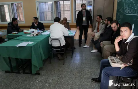 Palestinians update their details at a centre run by the Palestinian Central Election Commission (CEC), in Gaza city on February 12, 2013. The Palestinian Central Election Commission (CEC) began on Monday registering vot...