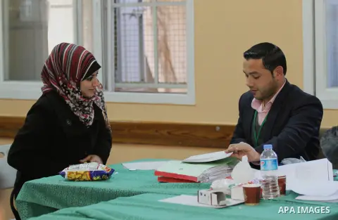 Palestinians update their details at a centre run by the Palestinian Central Election Commission (CEC), in Gaza city on February 12, 2013. The Palestinian Central Election Commission (CEC) began on Monday registering vot...