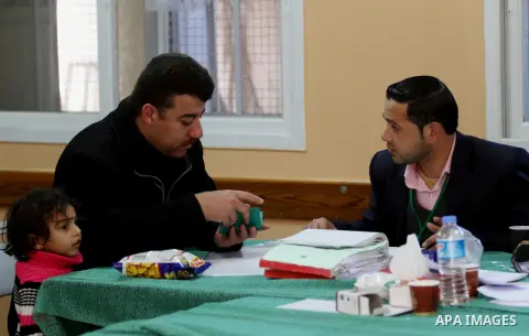 Palestinians update their details at a centre run by the Palestinian Central Election Commission (CEC), in Gaza city on February 12, 2013. The Palestinian Central Election Commission (CEC) began on Monday registering vot...