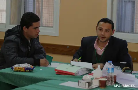 Palestinians update their details at a centre run by the Palestinian Central Election Commission (CEC), in Gaza city on February 12, 2013. The Palestinian Central Election Commission (CEC) began on Monday registering vot...
