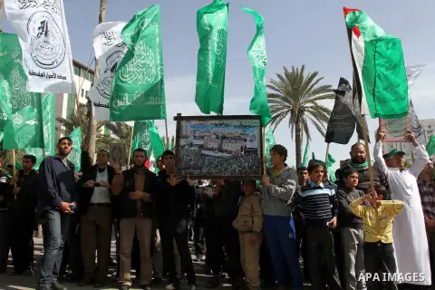 Hamas supporters chant slogans during a march following Friday prayers in Gaza City on March 8, 2013. Hamas and Islamic Jihad called a march in solidarity with the Al-Aqsa Mosque in Jerusalem's old city, Islam's third ho...