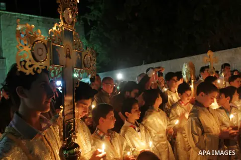 Palestinian Orthodox celebrate Holy Fire ceremony at the Saint Porfirios church in Gaza City early Gaza City May 05, 2013. Photo by Naaman Omar