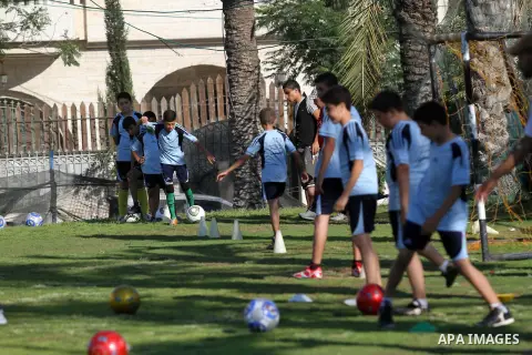 Palestinian boys play soccer in training exercises at a soccer club during their summer holiday in Gaza city on June 19, 2013. Photo by Ashraf Amra