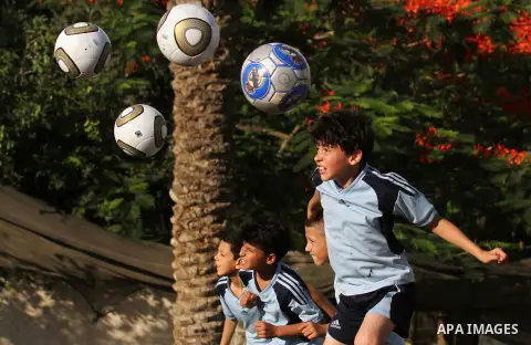 Palestinian boys play soccer in training exercises at a soccer club during their summer holiday in Gaza city on June 19, 2013. Photo by Ashraf Amra