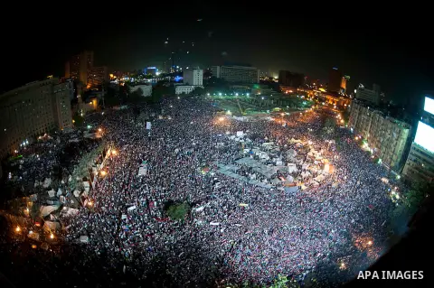 Fireworks light the sky as opponents of Egypt's Islamist President Mohammed Morsi protest in Tahrir square, in Cairo, Egypt, Tuesday, July 2, 2013. With the clock ticking, Egypt's besieged president said Tuesday that he...