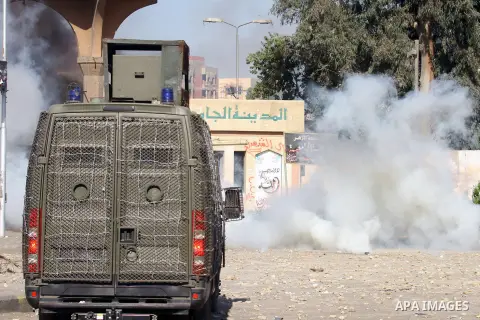 Students of Al-Azhar University, who are supporters of the Muslim Brotherhood and deposed President Mohamed Mursi, clash with riot police and residents of the area at the Al-Azhar University campus in Cairo's Nasr City d...