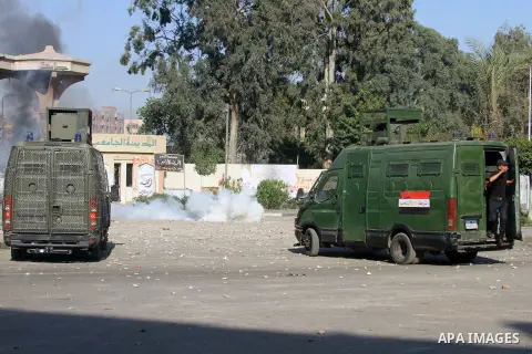 Students of Al-Azhar University, who are supporters of the Muslim Brotherhood and deposed President Mohamed Mursi, clash with riot police and residents of the area at the Al-Azhar University campus in Cairo's Nasr City d...