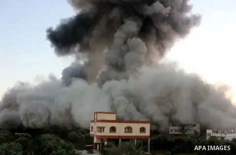 Smoke and flames are seen following what police said was an Israeli air strike in Gaza City July 8, 2014. Israel bombarded the Gaza Strip on Tuesday in strikes that Palestinian officials said killed at least 11 people, s...