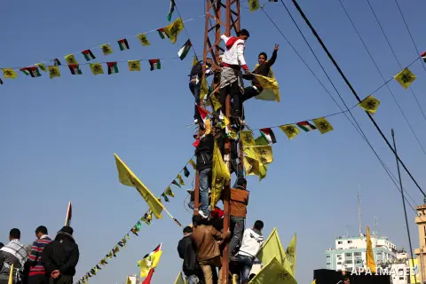 Palestinians take part in a rally marking the 48th anniversary of the founding of the Fatah movement, in Gaza City January 4, 2013. Hundreds of thousands of Palestinians joined a rare rally staged by President Mahmoud Ab...