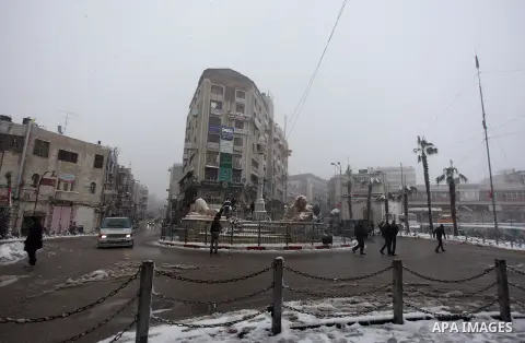 Palestinians play in the snow in the West Bank city of Ramallah January 10, 2013. At least 17 people have died due to a storm in Lebanon, Jordan, Turkey, Israel and the Palestinian territories. Meteorological agencies in...